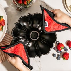 Alternative view of Lodge New Arrival Cast Iron Fluted Cake Pan with Red Potholders